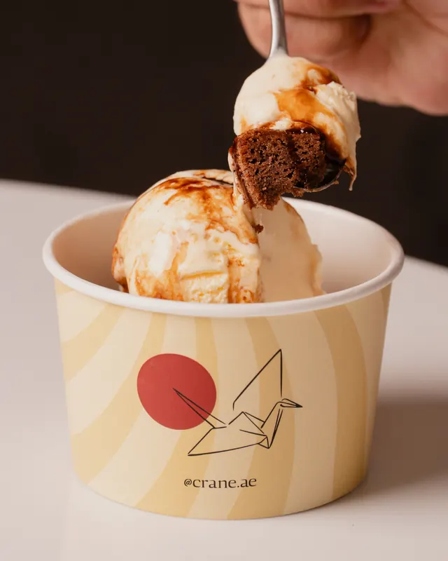 Vanilla ice cream with chocolate cake in a Crane cup