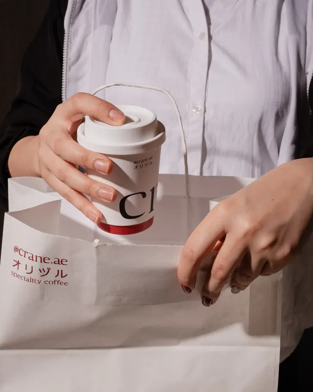 A Crane coffee being packed into a takeaway bag